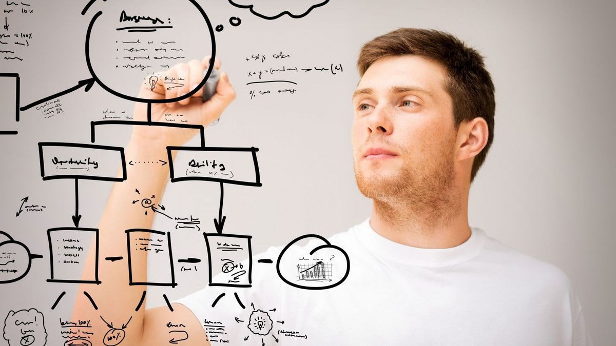 enlarge the image: Young man pointing on a mind map