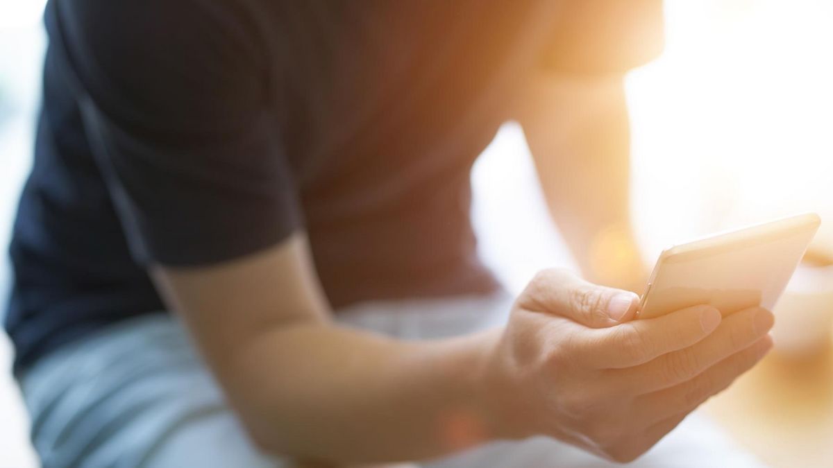 Young man looking at a smart phone